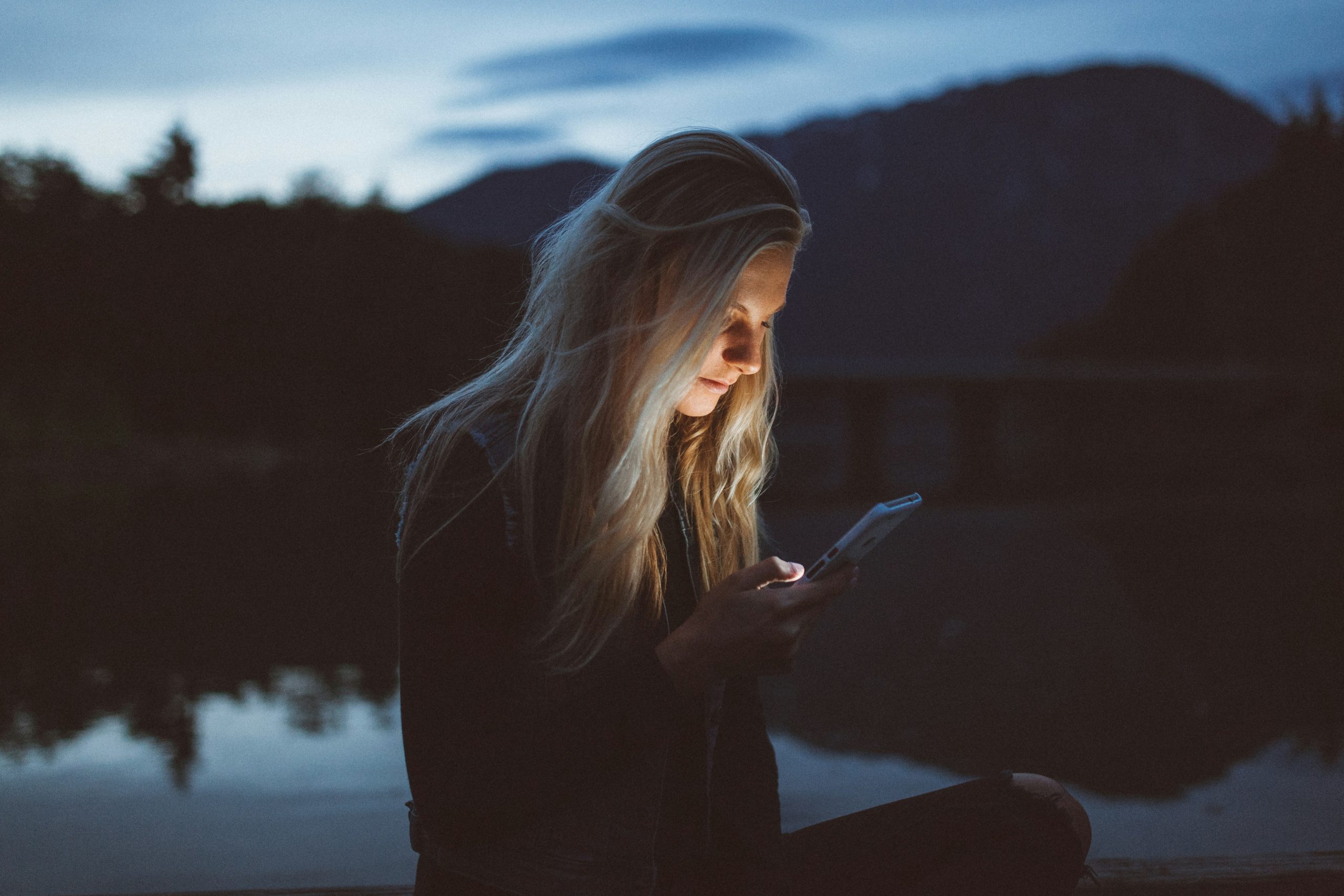 A woman is checking her iphone. 